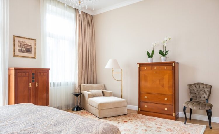 A modern bedroom with vintage mid-century furniture pieces.
